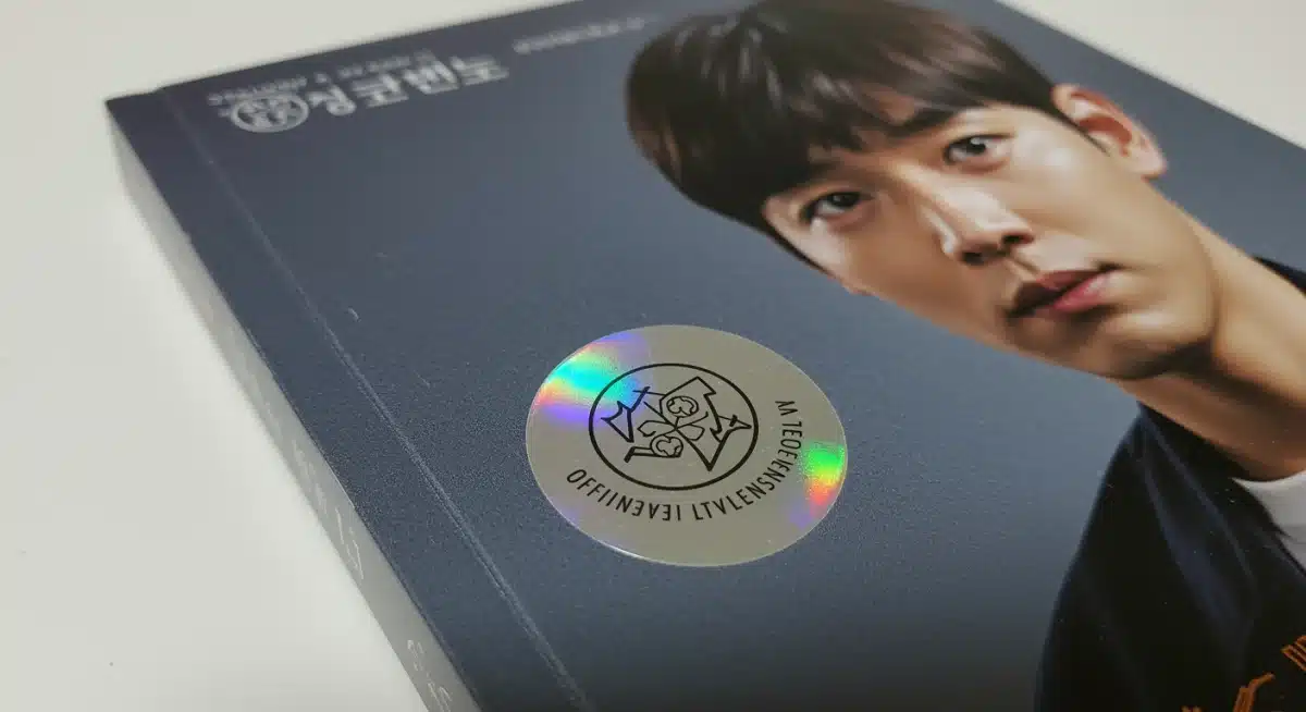 Holographic sticker on an official K-drama OST album packaging as a mark of authenticity.